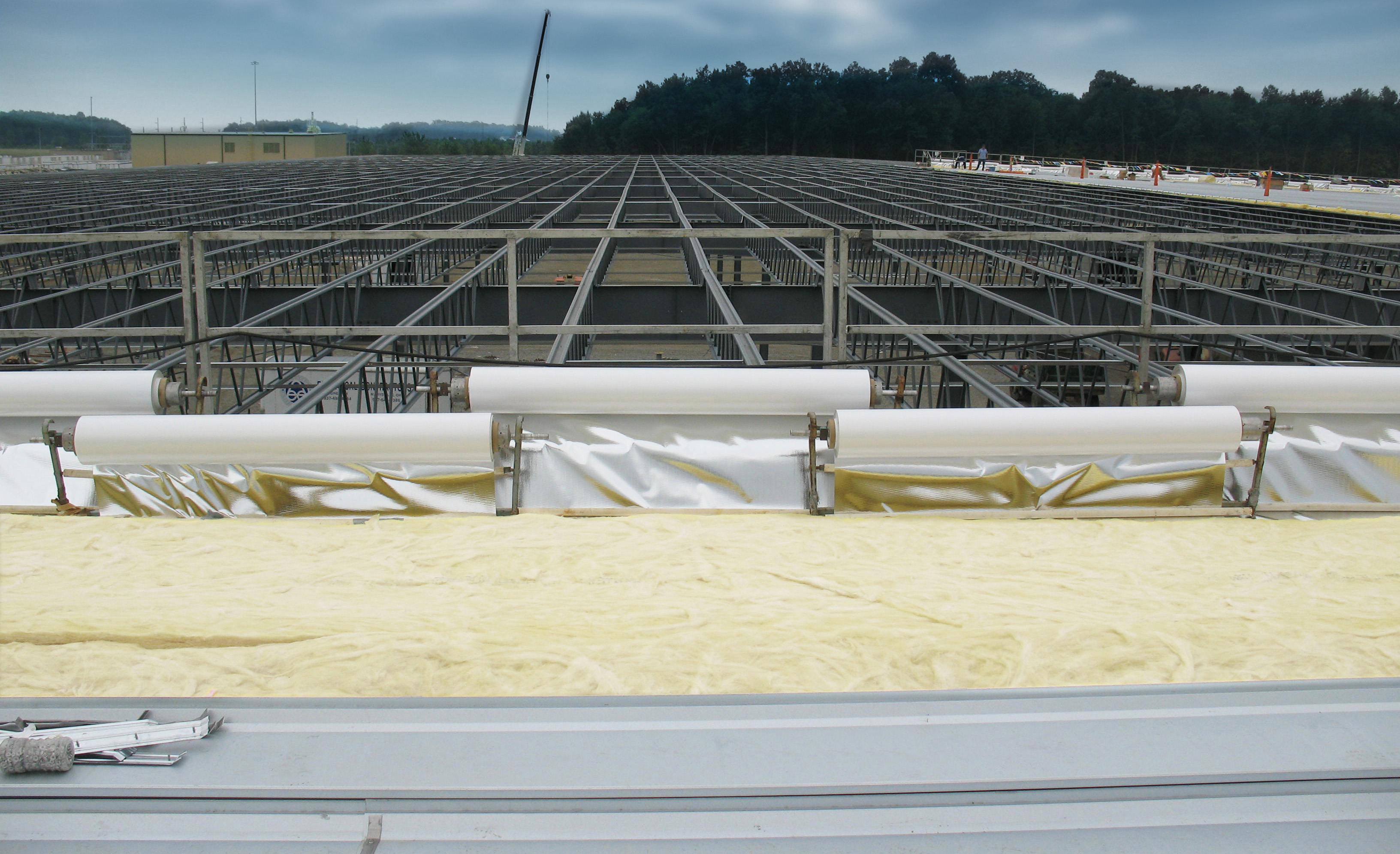Photo of Fabricated Insulation Products being installed on a commercial building